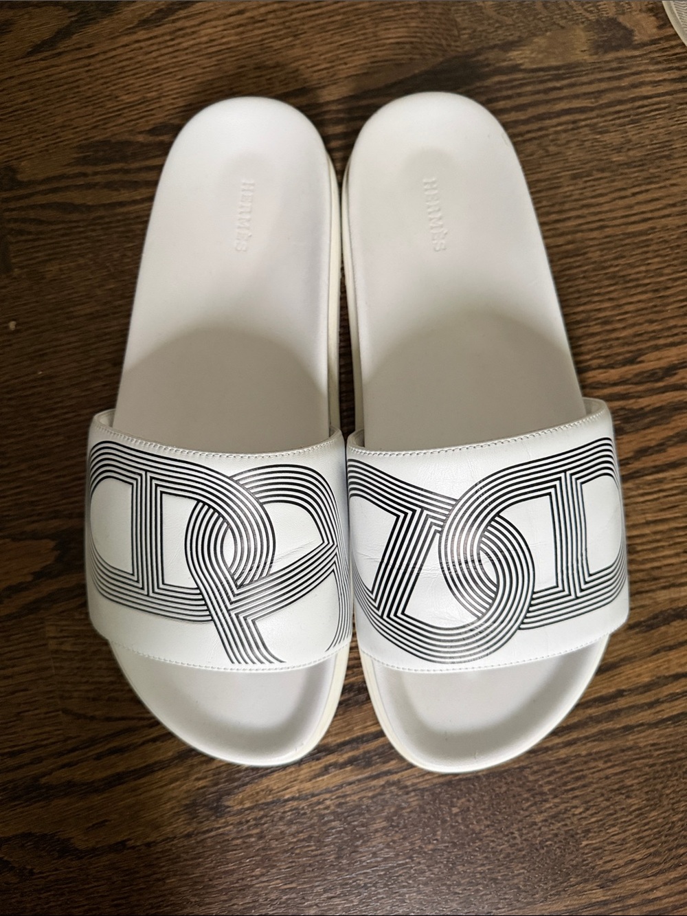 Hermes White Slide Sandals with Black Graphic Logo - men